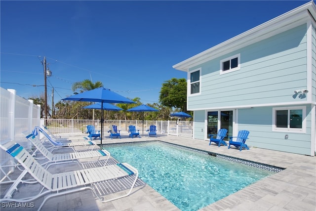 view of swimming pool with a patio area