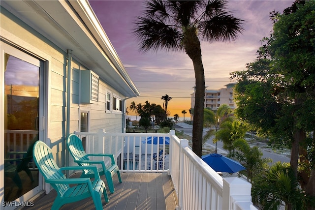 view of balcony at dusk