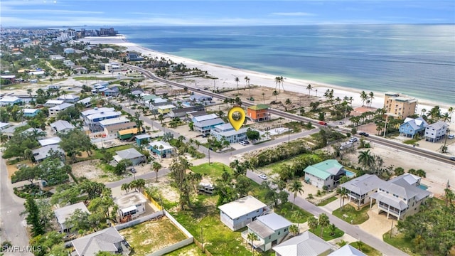 aerial view featuring a view of the beach and a water view