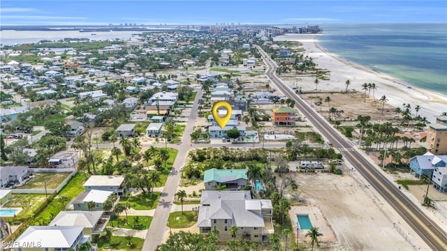 drone / aerial view with a water view and a view of the beach