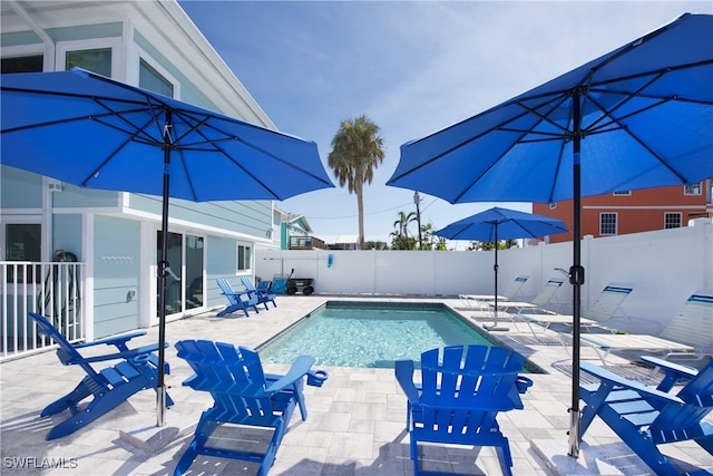 view of swimming pool featuring a patio