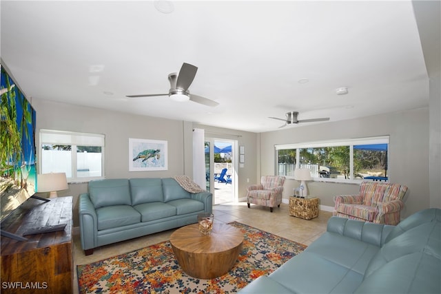 living room with ceiling fan and light tile patterned floors