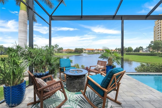 view of patio featuring a water view and an outdoor fire pit