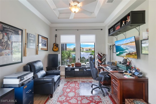 office area featuring ceiling fan, a raised ceiling, visible vents, and light wood-style floors