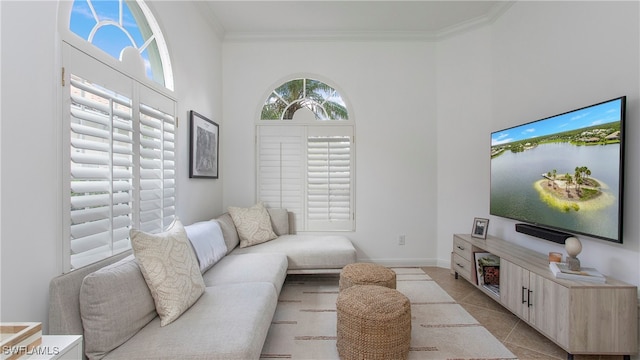 living room with light tile patterned floors and ornamental molding