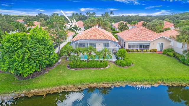 birds eye view of property with a water view