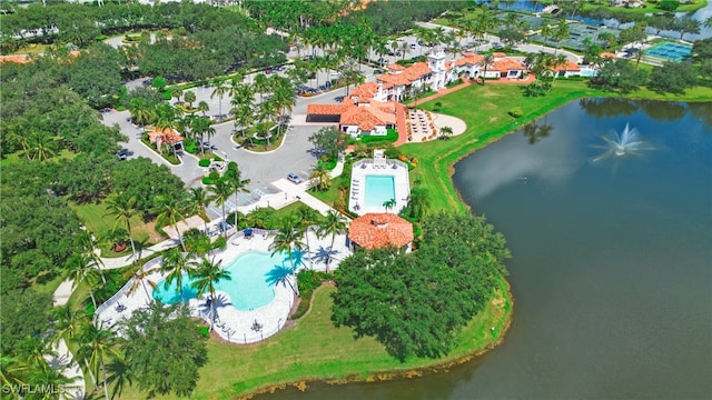 birds eye view of property with a water view