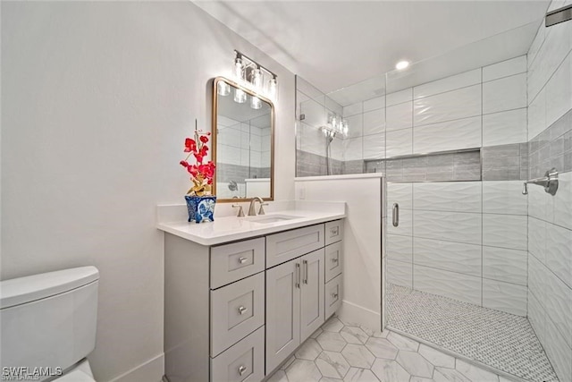 bathroom with vanity, toilet, an enclosed shower, and tile patterned floors