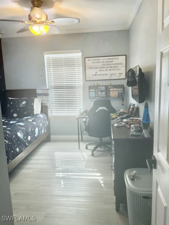 bedroom with wood-type flooring, ceiling fan, and crown molding