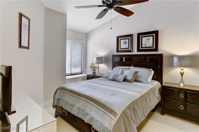 carpeted bedroom featuring lofted ceiling and ceiling fan