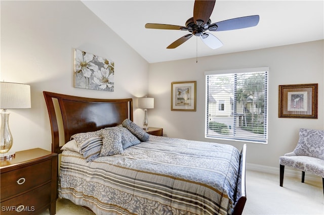 bedroom featuring ceiling fan, lofted ceiling, and light carpet