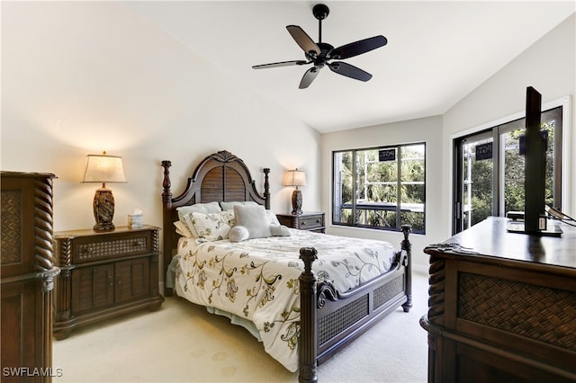 carpeted bedroom with vaulted ceiling, ceiling fan, and access to exterior