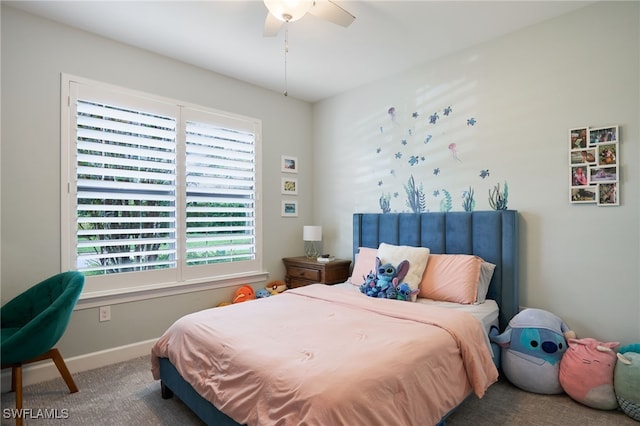 bedroom with ceiling fan, carpet floors, and multiple windows