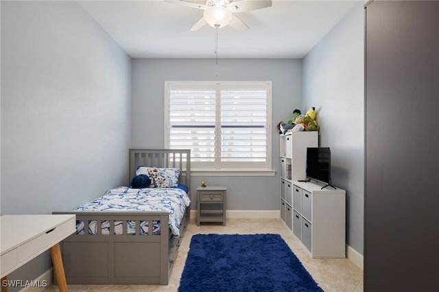 bedroom with light tile patterned floors and ceiling fan