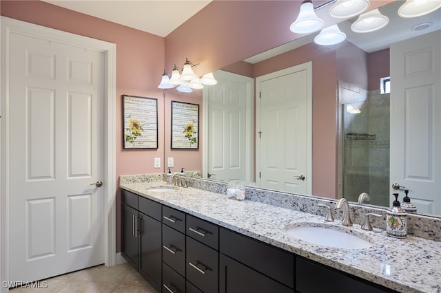 bathroom with vanity, an enclosed shower, and tile patterned floors