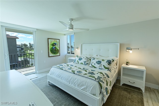 bedroom featuring ceiling fan, dark hardwood / wood-style floors, and access to outside