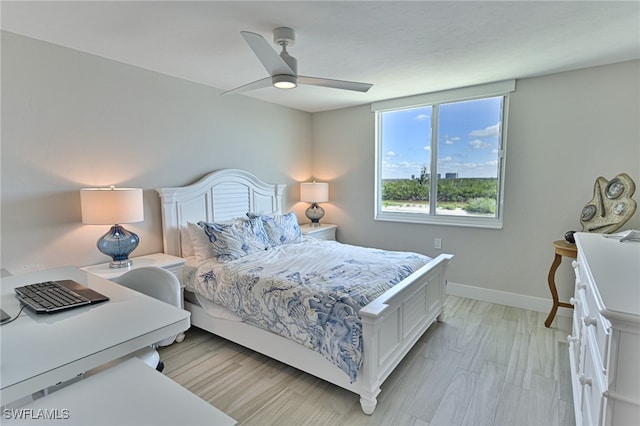 bedroom featuring ceiling fan and light wood-type flooring