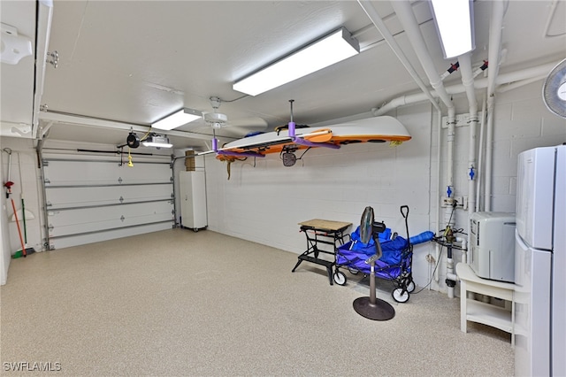 garage featuring white fridge