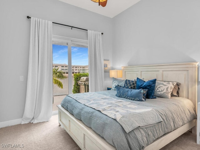 bedroom featuring access to outside and light colored carpet