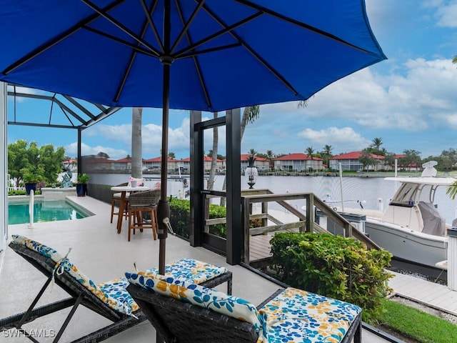 view of patio with a water view