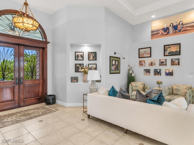 interior space featuring a high ceiling and french doors