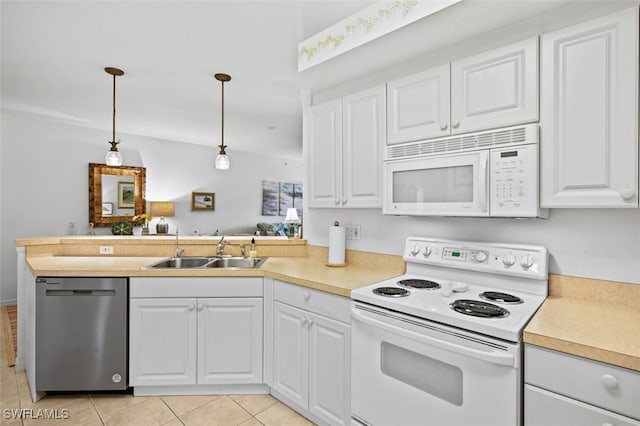 kitchen featuring white cabinetry, sink, and white appliances