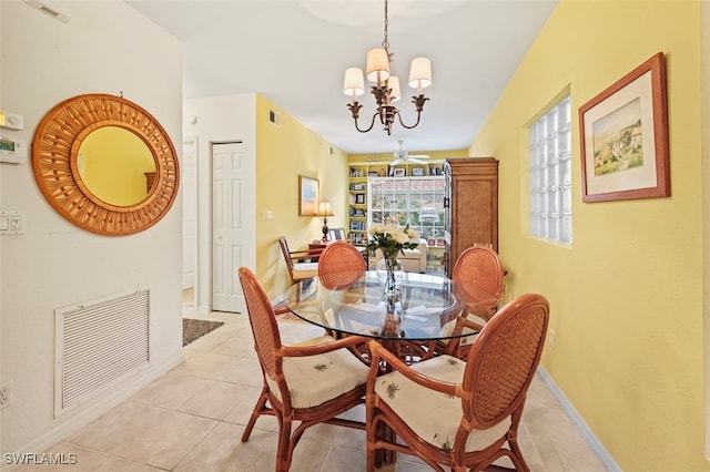 tiled dining area with an inviting chandelier