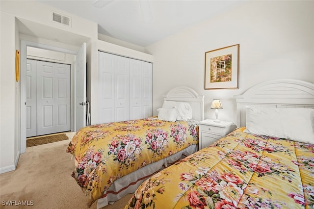 bedroom with light carpet, ceiling fan, and a closet