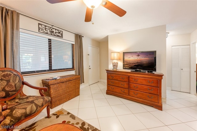 interior space with ceiling fan