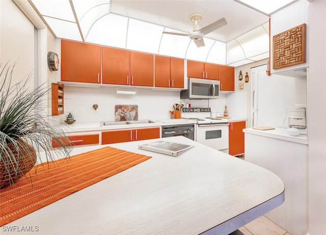 kitchen with ceiling fan, white range with electric cooktop, black dishwasher, and sink