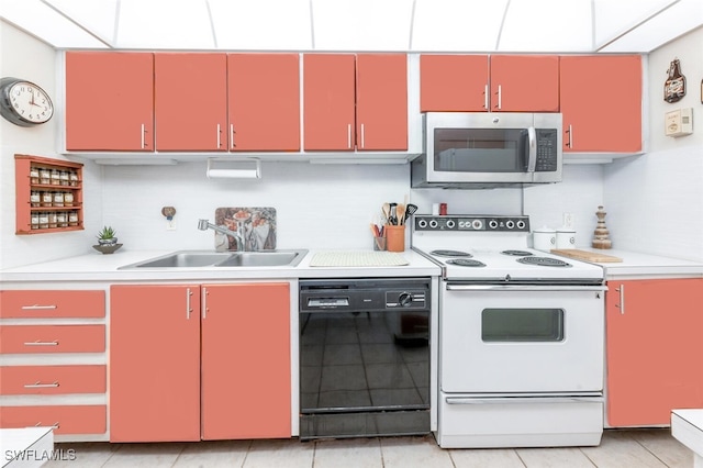 kitchen featuring dishwasher, electric stove, light tile patterned floors, and sink