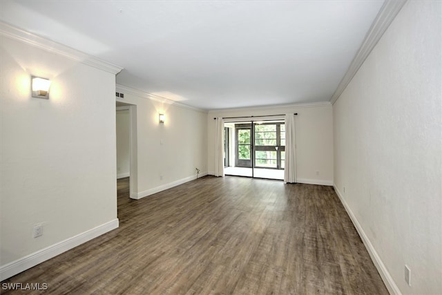 spare room with crown molding and dark hardwood / wood-style floors