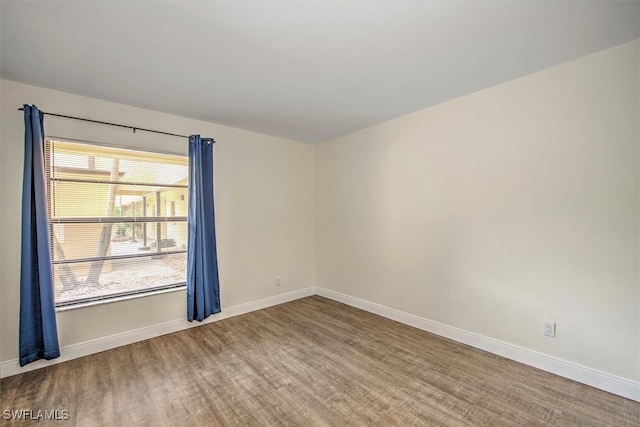 empty room featuring hardwood / wood-style flooring