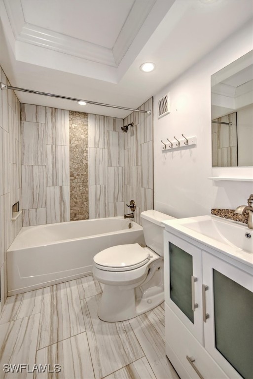 full bathroom featuring shower / bath combo, vanity, toilet, and ornamental molding