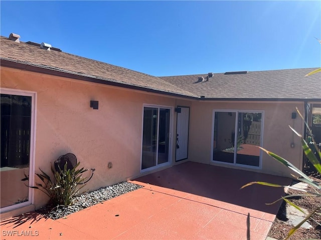 back of house with a patio area