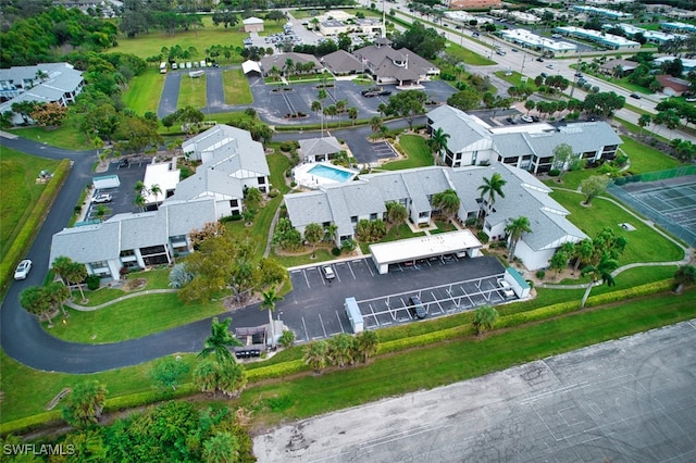 birds eye view of property with a residential view