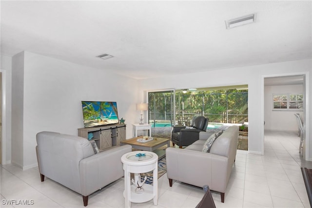 living room with light tile patterned floors