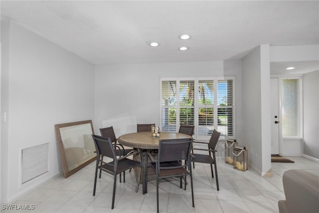 dining space with light tile patterned flooring