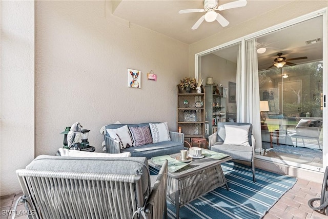 view of patio featuring an outdoor hangout area, ceiling fan, and visible vents