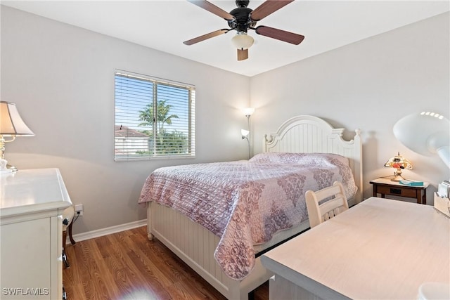 bedroom with baseboards, wood finished floors, and a ceiling fan