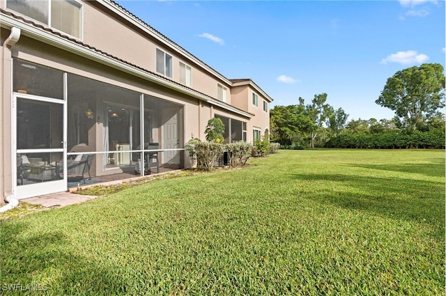 view of yard with a sunroom
