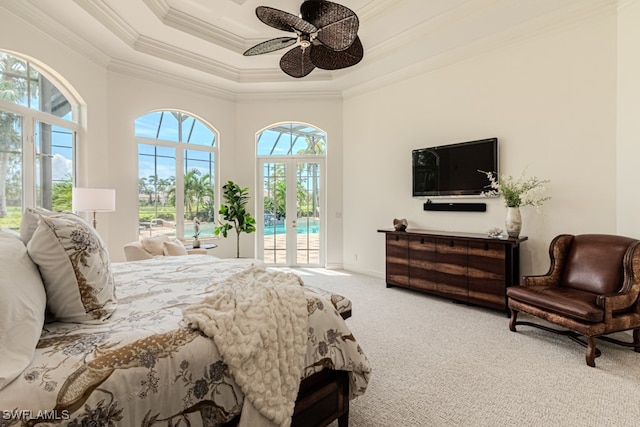 carpeted bedroom with multiple windows, access to outside, ornamental molding, and ceiling fan