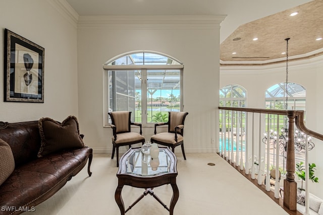 interior space with carpet flooring, ornamental molding, and a notable chandelier