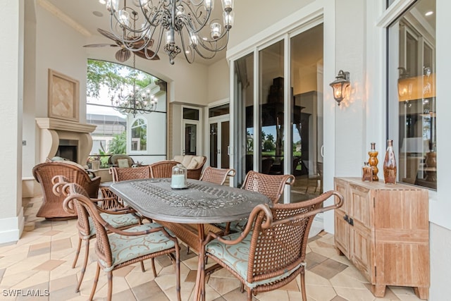 dining space featuring light tile patterned floors and a chandelier