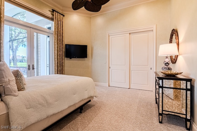 carpeted bedroom featuring crown molding, ceiling fan, french doors, and access to exterior