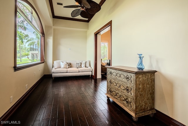 sitting room featuring ceiling fan, dark hardwood / wood-style floors, and ornamental molding