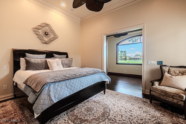 bedroom with ceiling fan, crown molding, and dark hardwood / wood-style flooring