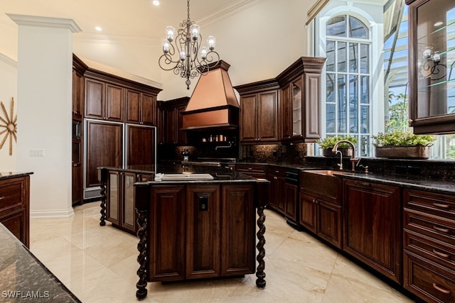 kitchen with backsplash, decorative light fixtures, dark brown cabinets, and a notable chandelier