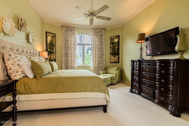 carpeted bedroom with crown molding and ceiling fan