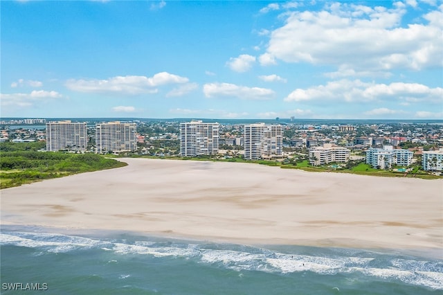 bird's eye view featuring a view of the beach and a water view